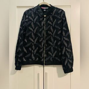 Transparent jacket to wear over a top or dress.